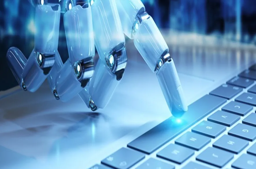 Robotic hand pressing computer keyboard with glowing fingertips, automation technology concept.